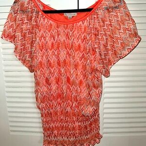 Very pretty orange multi colored blouse.